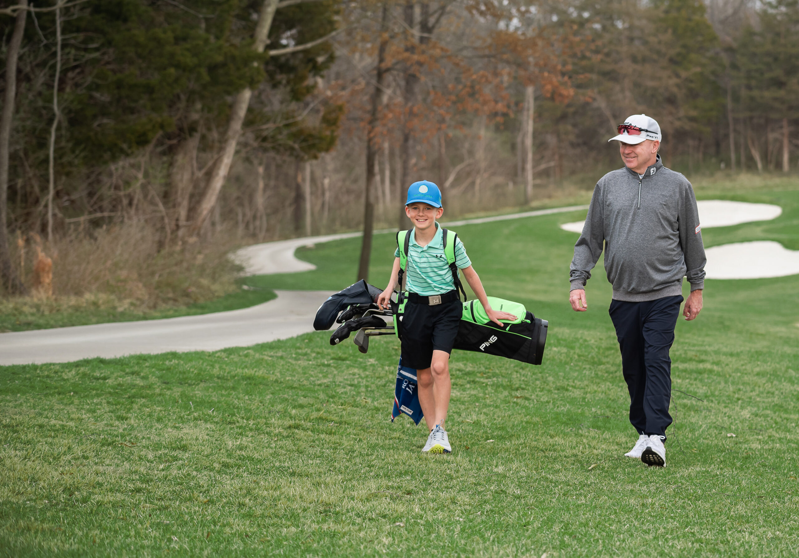 Junior golfer and mentor on course